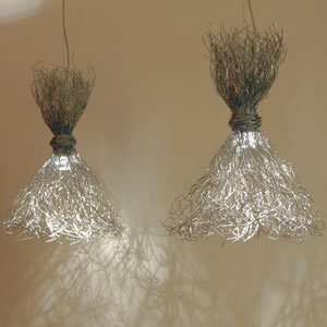 Modern pendant lights creating visual drama and providing excellent ambient light.